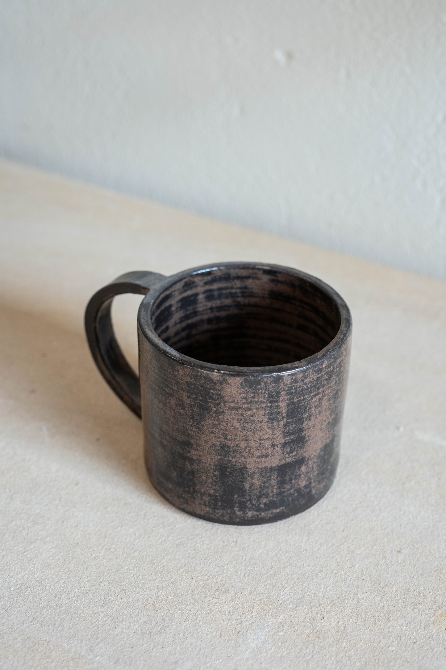 Dark red-black mug with handle