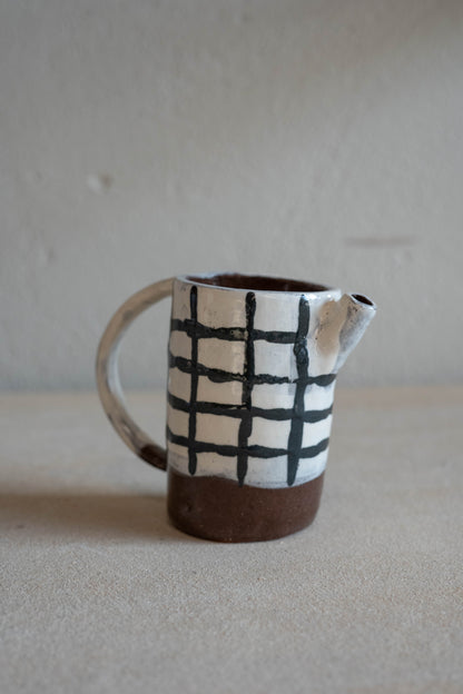 Small checkered jug with handle