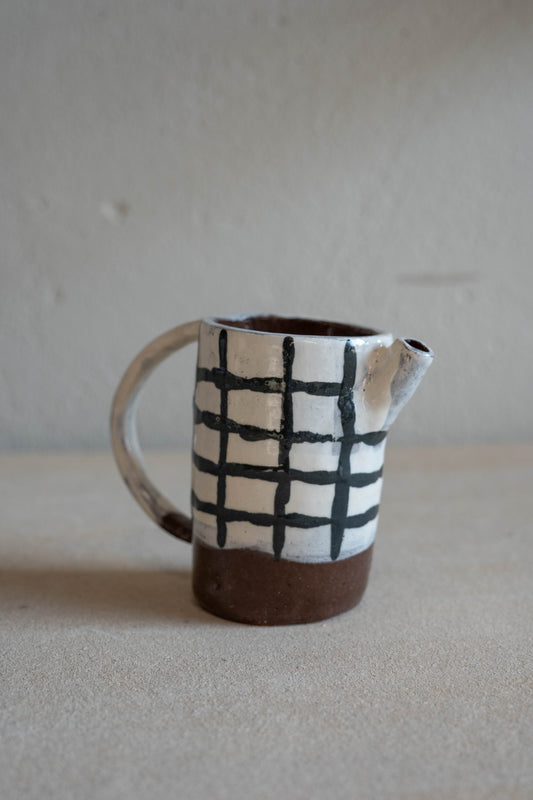 Small checkered jug with handle
