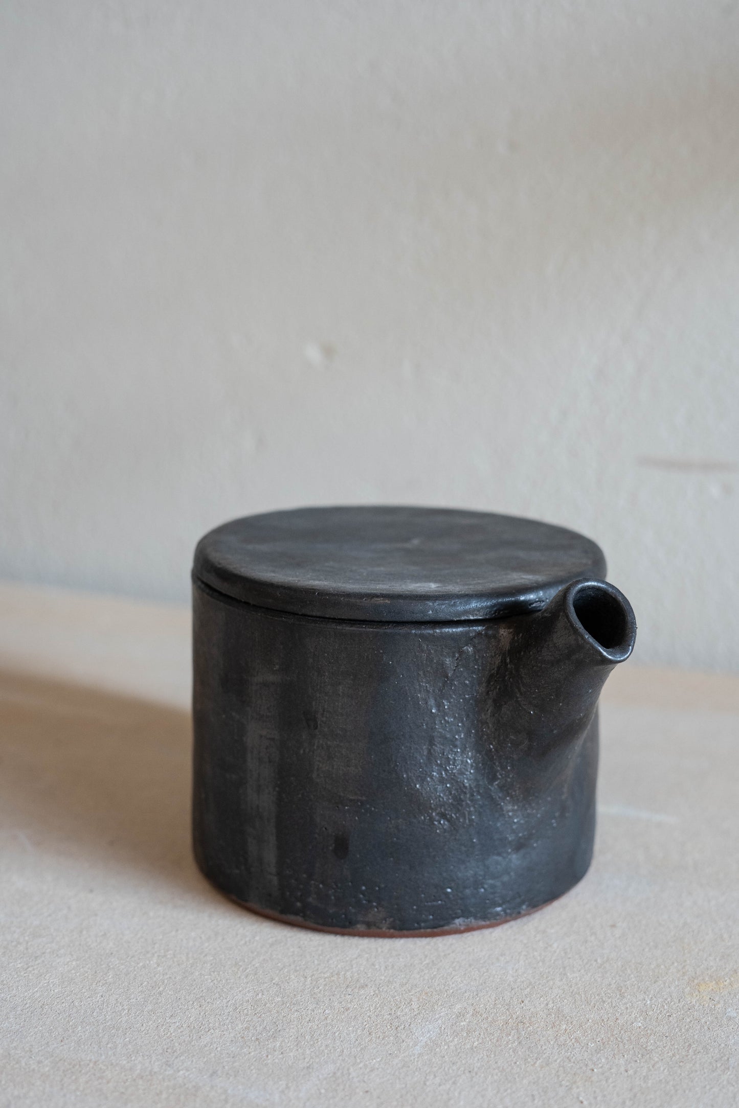 Small black teapot